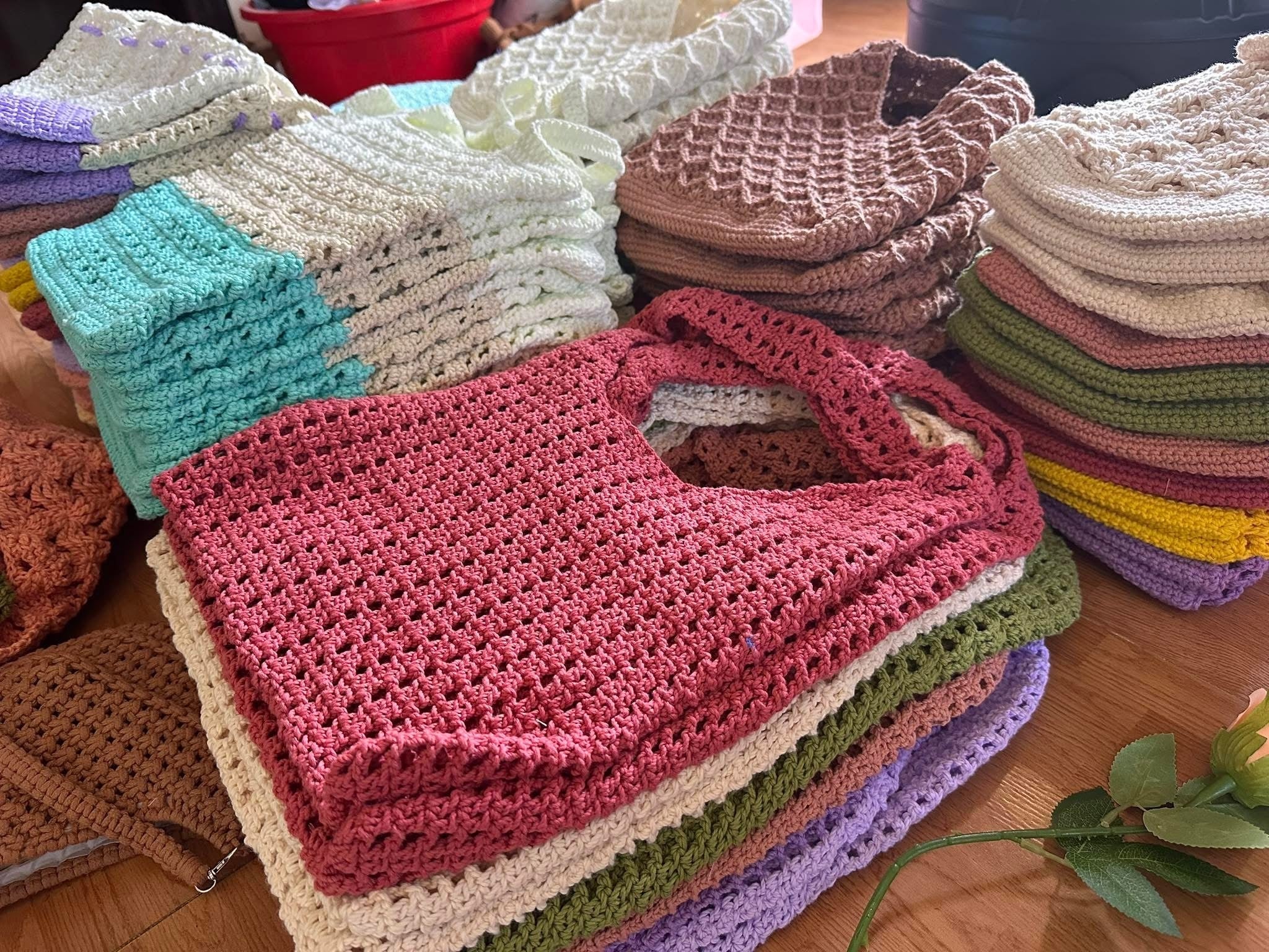Handmade crochet tote bags ready for final quality check and packaging
